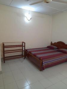 a bedroom with a large bed in a room at Seven Star Guest Inn in Passara