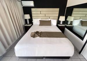 Postel nebo postele na pokoji v ubytování Hotel Guillen