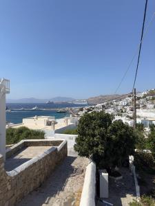 a view of a city from a building at Anemi KHORA in Mikonos