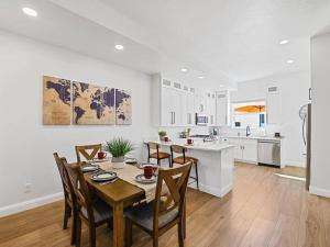 a kitchen and dining room with a table and chairs at Alpine Deer Hideaway in Eden