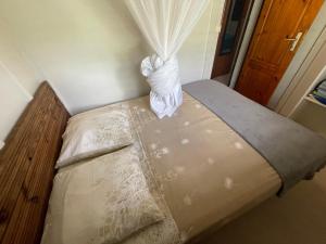 Postel nebo postele na pokoji v ubytování Kaz ANTHURIUM