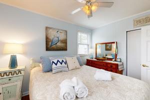 a bedroom with a bed with towels on it at Town of Rehoboth Beach --- 37200 Burton Ave. in Rehoboth Beach