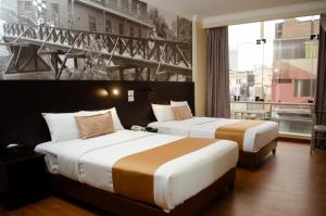 Postel nebo postele na pokoji v ubytování Hotel María Luisa