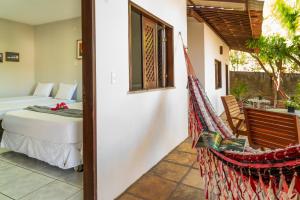 Cama ou camas em um quarto em Casa Suiça Brasileira