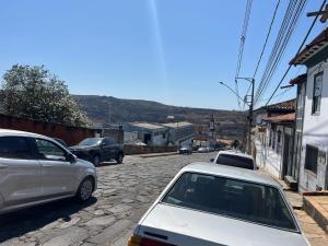 a group of cars parked on a street at Hostel Diamante in Diamantina