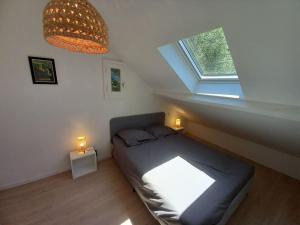 a small room with a couch and a window at Maison Le Bain de L'Ours in Bazus-Aure
