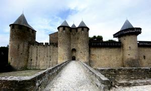 a large castle with two towers and a bridge at Studio jacuzzi à l'abri des vents in Carcassonne