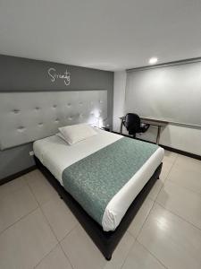 Postel nebo postele na pokoji v ubytování Aw Hotel Serenity Ferial