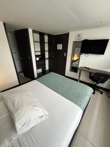 Postel nebo postele na pokoji v ubytování Aw Hotel Serenity Ferial