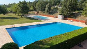 an overhead view of a swimming pool in a yard at Apartament acollidor al Berguedà 6p in Sant Jordi de Cercs