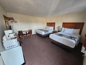 Postel nebo postele na pokoji v ubytování Huntsville Inn