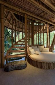 Postel nebo postele na pokoji v ubytování Bamboo Homestay Tà Xùa
