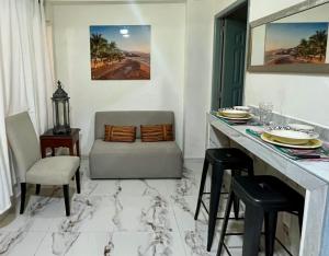 a dining room with a table and chairs at La Puerta Blanca #2 in Puerto Vallarta +11 photos