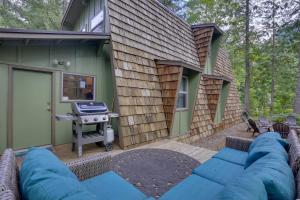 a backyard with a grill and a house at Rhododendron Family Cabin Hot Tub and Deck! in Rhododendron