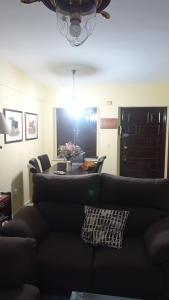 a living room with a couch and a table at Duplex convento la victoria in Sanlúcar de Barrameda +16 photos