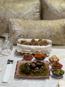 a table with a plate of food on a table at Riad Safia in Rabat +124 photos