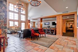 a large living room with a couch and chairs at 2 Bedroom Colorado Vacation Rental In River Run Village With Pool And Hot Tub Access in Keystone