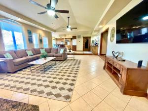 a living room with a couch and a table at Beaver Lake Getaway in Rogers +32 photos