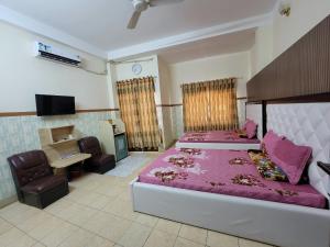 Ένα ή περισσότερα κρεβάτια σε δωμάτιο στο Thiên Nga Hotel