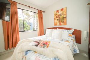 Cama ou camas em um quarto em Imperial Inn Hospedaje Turistico
