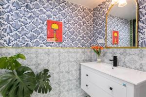 a bathroom with a sink and a mirror at 上海希之民宿 in Shanghai