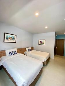 Postel nebo postele na pokoji v ubytování Siri Hotel Phuket