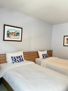 Postel nebo postele na pokoji v ubytování Siri Hotel Phuket