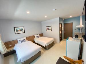 Postel nebo postele na pokoji v ubytování Siri Hotel Phuket