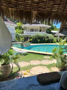 a view of a house and a swimming pool at Cosy Cottage Marine Park at Malindi Beach in Malindi