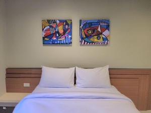 Postel nebo postele na pokoji v ubytování Siri Hotel Phuket