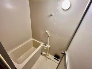 Koupelna v ubytování Apartment Hotel 下野