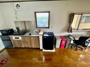 Kuchyň nebo kuchyňský kout v ubytování Apartment Hotel 下野
