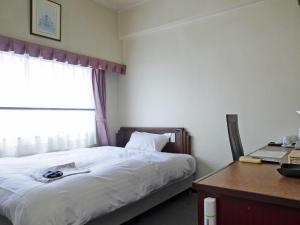 Postel nebo postele na pokoji v ubytování Hotel Union