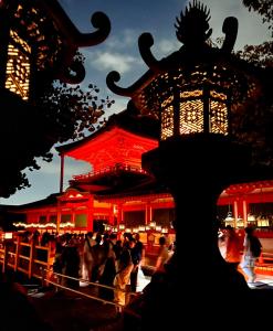 a crowd of people standing in front of a building at Guesthouse Naramachi in Nara
