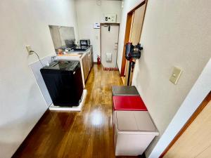 Kuchyň nebo kuchyňský kout v ubytování Apartment Hotel 下野