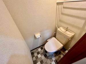 Koupelna v ubytování Apartment Hotel 下野
