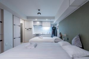 Krevet ili kreveti u jedinici u okviru objekta Apartment Hotel 11 Shinsaibashi