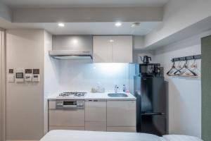 Kuhinja ili čajna kuhinja u objektu Apartment Hotel 11 Shinsaibashi