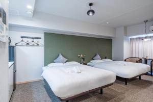 Krevet ili kreveti u jedinici u okviru objekta Apartment Hotel 11 Shinsaibashi