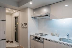 Kuhinja ili čajna kuhinja u objektu Apartment Hotel 11 Shinsaibashi