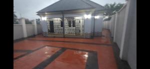 a gate to a house with a fence at Nexcon Apartments in Uyo