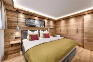 Łóżko lub łóżka w pokoju w obiekcie Apartment NH96 inklusive kostenfreiem Eintritt in die Alpentherme