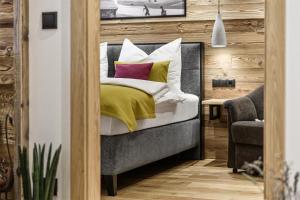 Łóżko lub łóżka w pokoju w obiekcie Apartment NH96 inklusive kostenfreiem Eintritt in die Alpentherme
