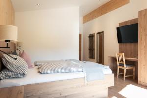 Postelja oz. postelje v sobi nastanitve Nagelehof Apartment Bendelstein