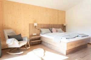 Postelja oz. postelje v sobi nastanitve Nagelehof Apartment Bendelstein