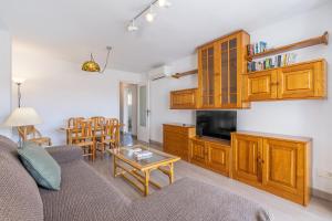 a living room with a couch and a table at Apto Mediterraneo 7 La Herradura in La Herradura