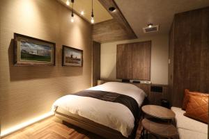 HOTEL Us Bentenbashi Adult onlyにあるベッド