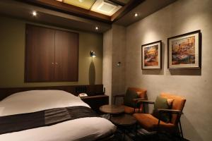 Postel nebo postele na pokoji v ubytování HOTEL Us Bentenbashi Adult only