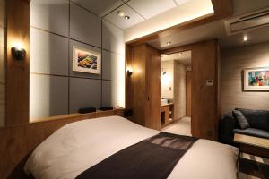 Postel nebo postele na pokoji v ubytování HOTEL Us Bentenbashi Adult only + 11 fotografií