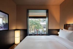 Katil atau katil-katil dalam bilik di Yeenjoy隐绅里酒店长沙五一广场国金中心店